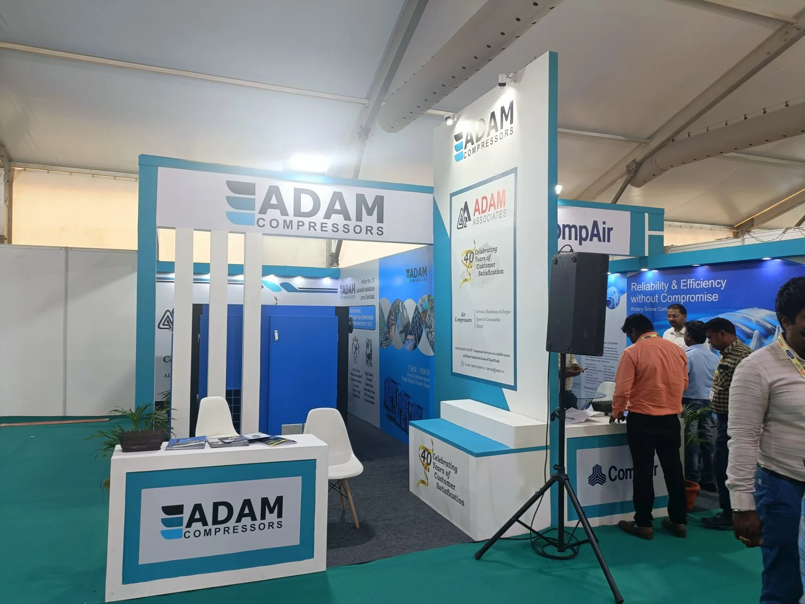 Corner exhibition stall designed and fabricated by ADMUG Studio for Adam Compressors