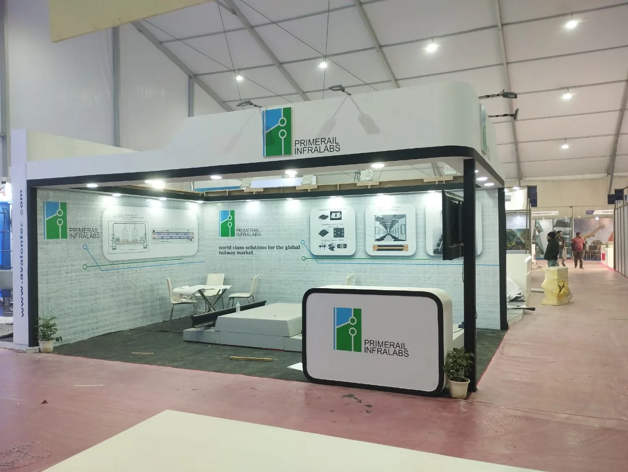 Corner exhibition stall designed and fabricated by ADMUG Studio for Primerail Infralabs