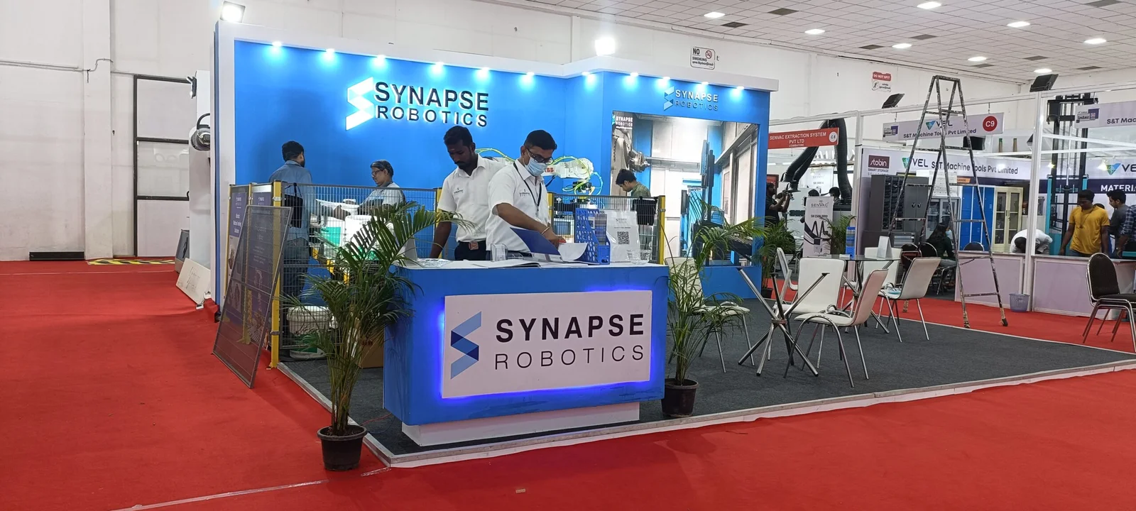 Corner exhibition stall designed and fabricated by ADMUG Studio for Synapse Robotics